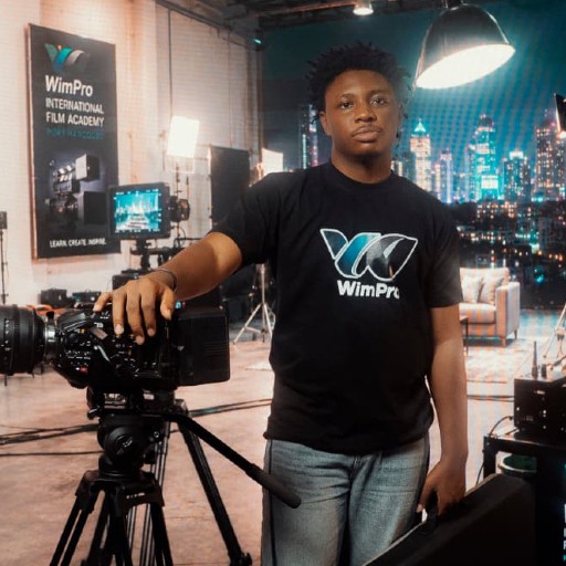 Black female director working on a bright professional movie set